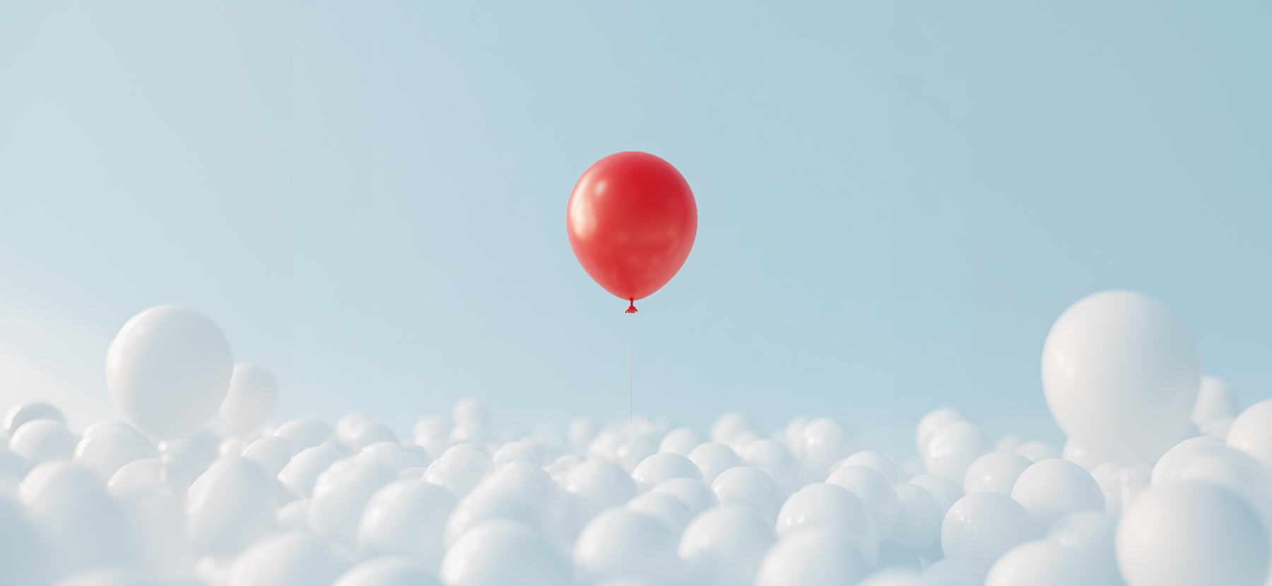 Red balloon standing out from a crowd of gray balloons, symbolizing brand positioning and market differentiation